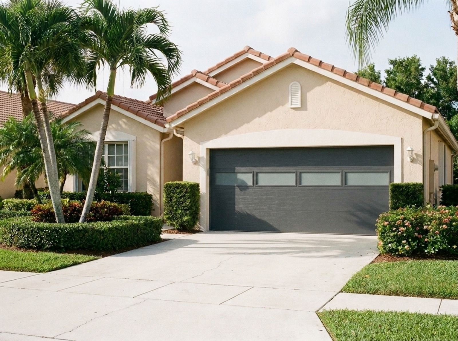 After: modern hurricane-rated charcoal garage door